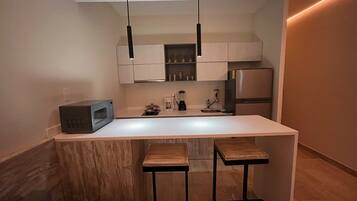 Estudio Deluxe, vista al resort | Cocina privada