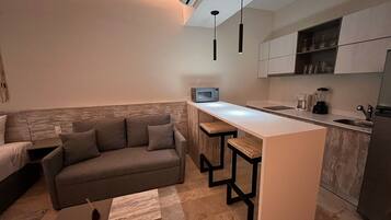 Estudio Deluxe, vista al resort | Área de sala de estar