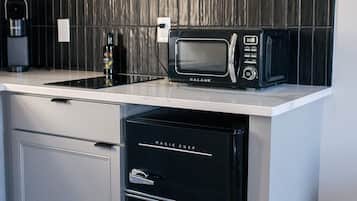 Microwave, stovetop, coffee/tea maker, cookware/dishes/utensils