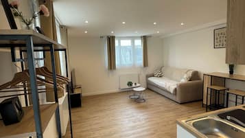 Studio Suite | Living area | 50-inch Smart TV with cable channels, Netflix, pay movies
