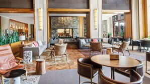 A spacious lobby with a fireplace, comfortable seating, and a bar area. - CRBC-Best of the Best! Brand New! Ski in/out, Resort & Spa, Hot tub, Ski Valet (Avon)