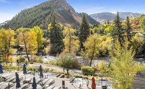 Relax on the patio with scenic mountain views and forest surroundings.