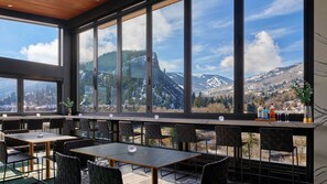 Enjoy a meal with a breathtaking view of the surrounding mountains from this dining area.