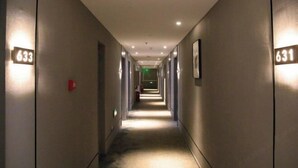 A hotel corridor with numbers 633 and 631 on the walls, indicating room numbers.