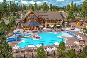 A resort with a large pool, outdoor seating, and a water slide. - The Cottages - Golf, Trails, Family Fun - 2-Bed (Truckee)