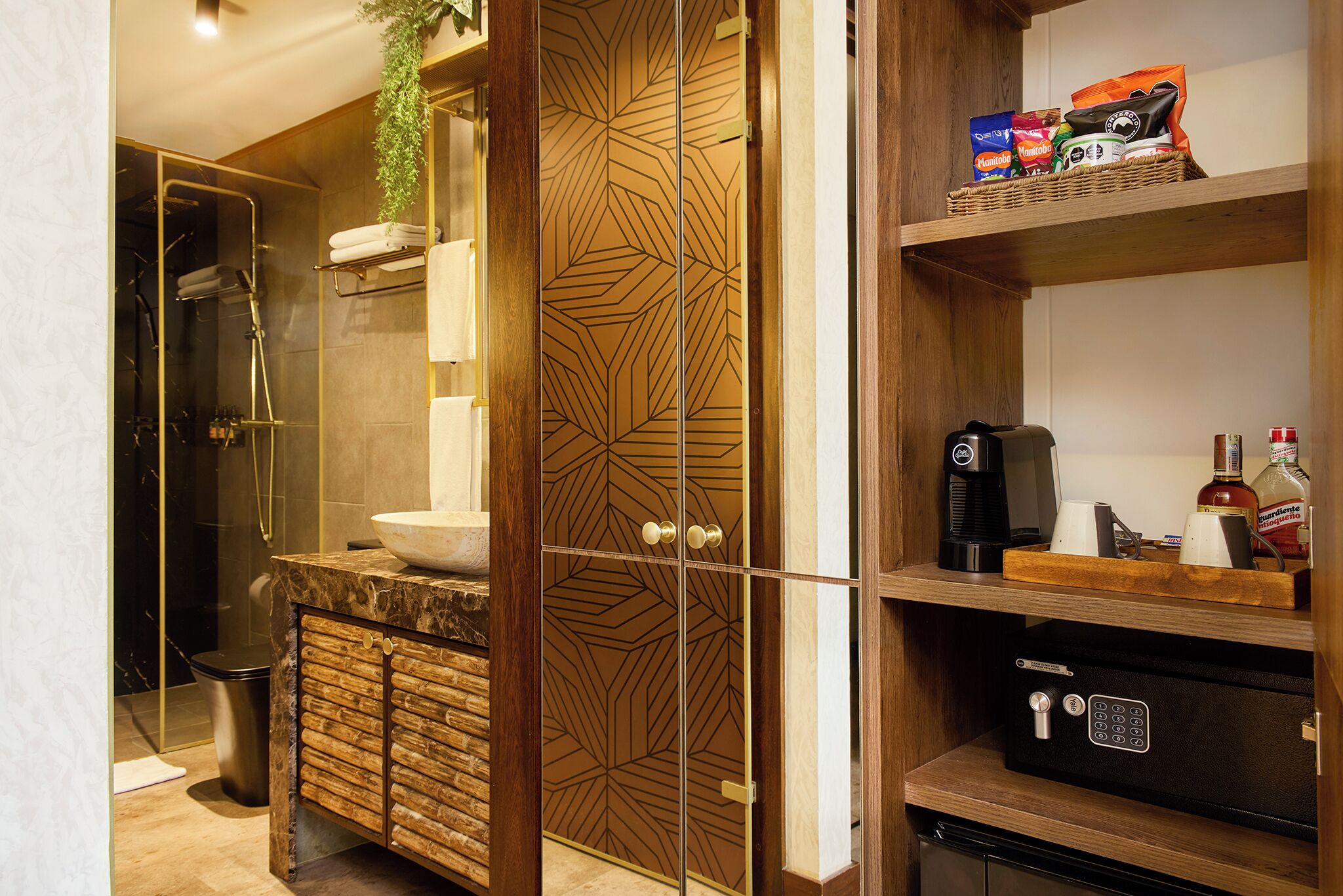 A modern bathroom with a shower, a vanity with a marble countertop, and a wooden cabinet with drawers.