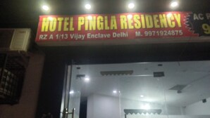 A hotel sign with the name 'HOTEL PINGLA RESIDENCY' and contact information. - Hotel Pingla Residency  (New Delhi)