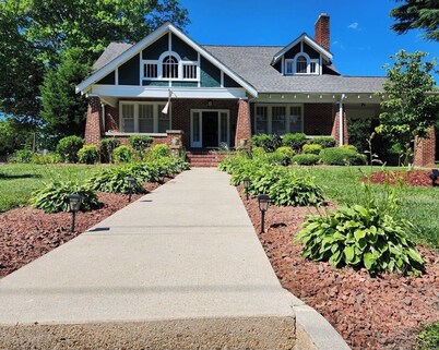 Enjoy small-town, Main Street from the front porch of this historic bungalow!