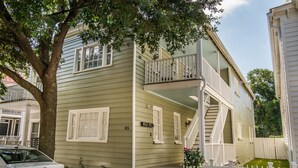 A two-story house with a front porch and a small balcony. - The Bogard Only 4 Blocks to King! Unit A (Charleston)