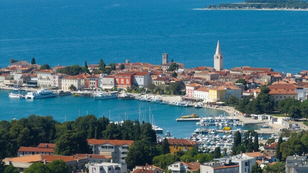 A coastal town with a marina, historic buildings, and a prominent tower. - House Ada (Istria - Poreč) (Poreč)
