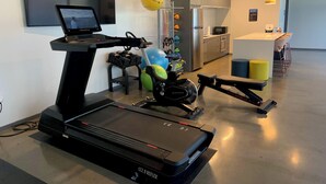 A home gym with a treadmill, stationary bike, and exercise balls. - Stylish Midtown of Sacramento Luxurious and Spacious Studio at level 6 nice view (Sacramento)