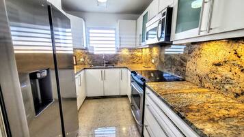 Coffee/tea maker, fridge, microwave, oven