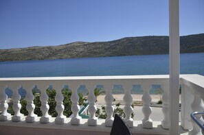 Relax on the balcony with unobstructed views of the serene lake and rolling hills.