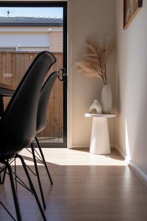Relax in a serene space with a seating area, natural decor, and a view of the outdoors.