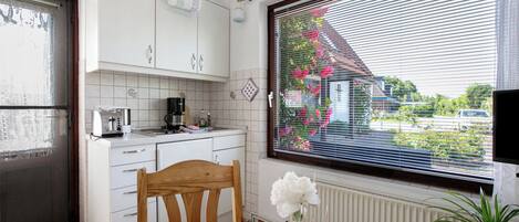 Fridge, stovetop, coffee/tea maker, electric kettle