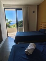 Basic Twin Room, 2 Twin Beds, Partial Ocean View | Free WiFi, bed sheets