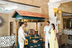 A food cart with a green roof and a sign that reads 'ARTH FINE FOODS.' - Gateway Bekal (Hosdurg)