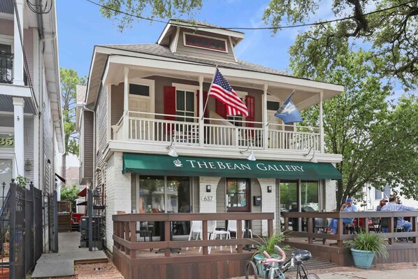 A two-story building with a green awning labeled "The Bean Gallery".
