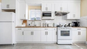 Coffee/tea maker, fridge, microwave, oven