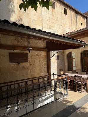 Standard Triple Room, Courtyard View | Garden view