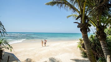 On the beach, sun-loungers, beach umbrellas, beach towels