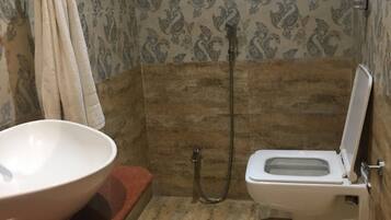 Shower, rainfall showerhead, towels, soap