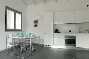Fridge, stovetop, dishwasher, dining tables