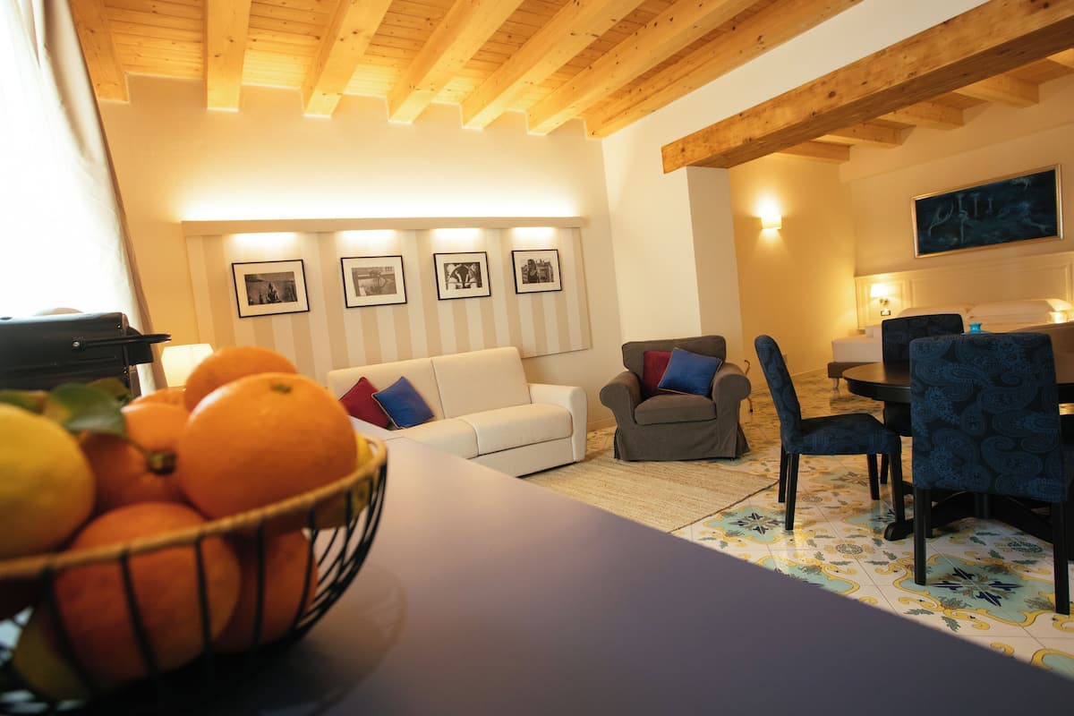 Family Quadruple Room, Balcony, City View | Living area