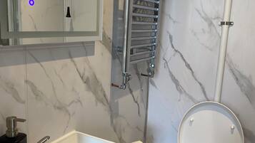 Shower, free toiletries, towels, toilet paper