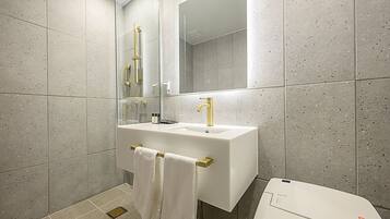 Designer toiletries, hair dryer, bathrobes, bidet