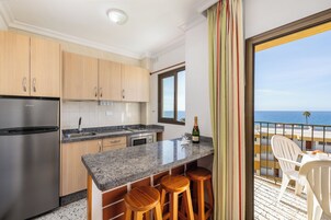 Full-size fridge, microwave, stovetop, coffee/tea maker