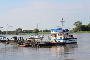Enjoy a serene riverside retreat with tranquil views and a pier perfect for leisure activities.