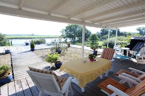 Enjoy a meal on the deck overlooking the water with a grill at your disposal.