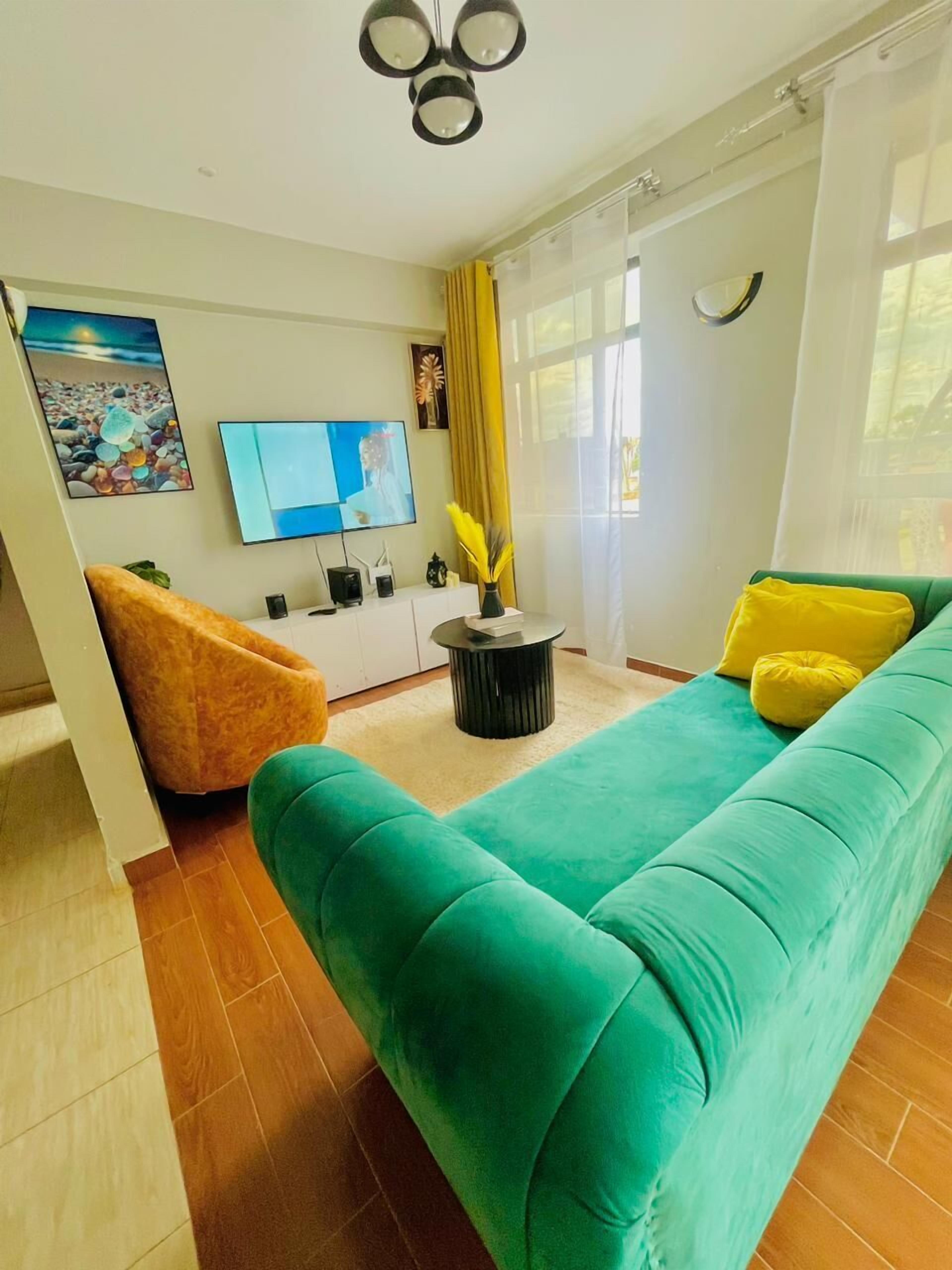 Business Apartment | Living area | 24-inch Smart TV with digital channels