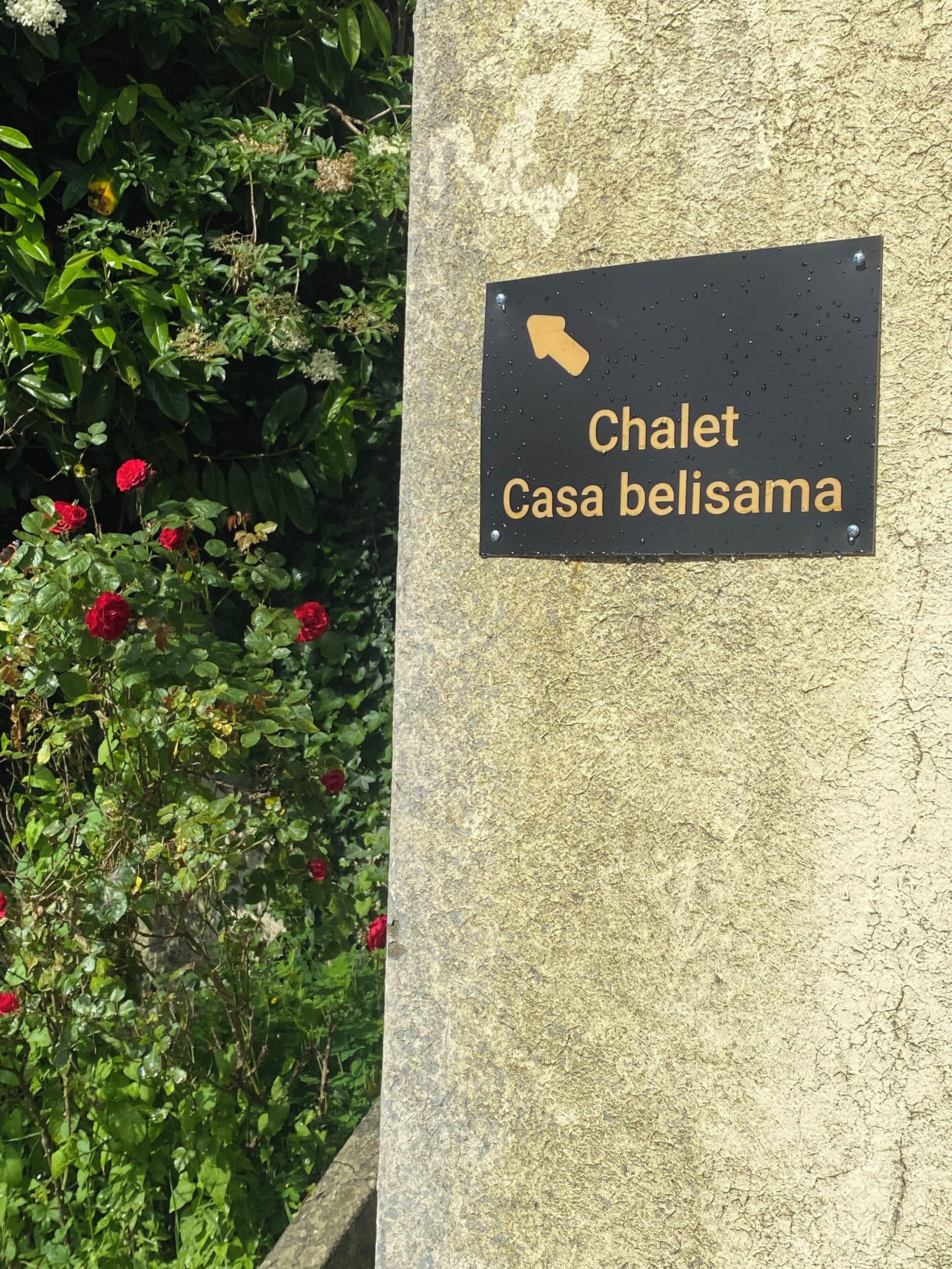 A sign with the text "Chalet Casa belisama" indicating a chalet location.