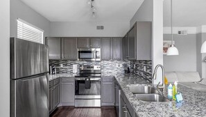 Fridge, dining tables - Landing | Spectacular 2BD, Pool, Gym (Fort Worth)