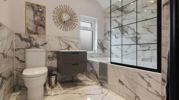 Shower, hair dryer, towels, soap