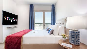 Apartemen Basic | 2 kamar tidur, selimut bulu angsa, meja kerja, dan Wi-Fi gratis