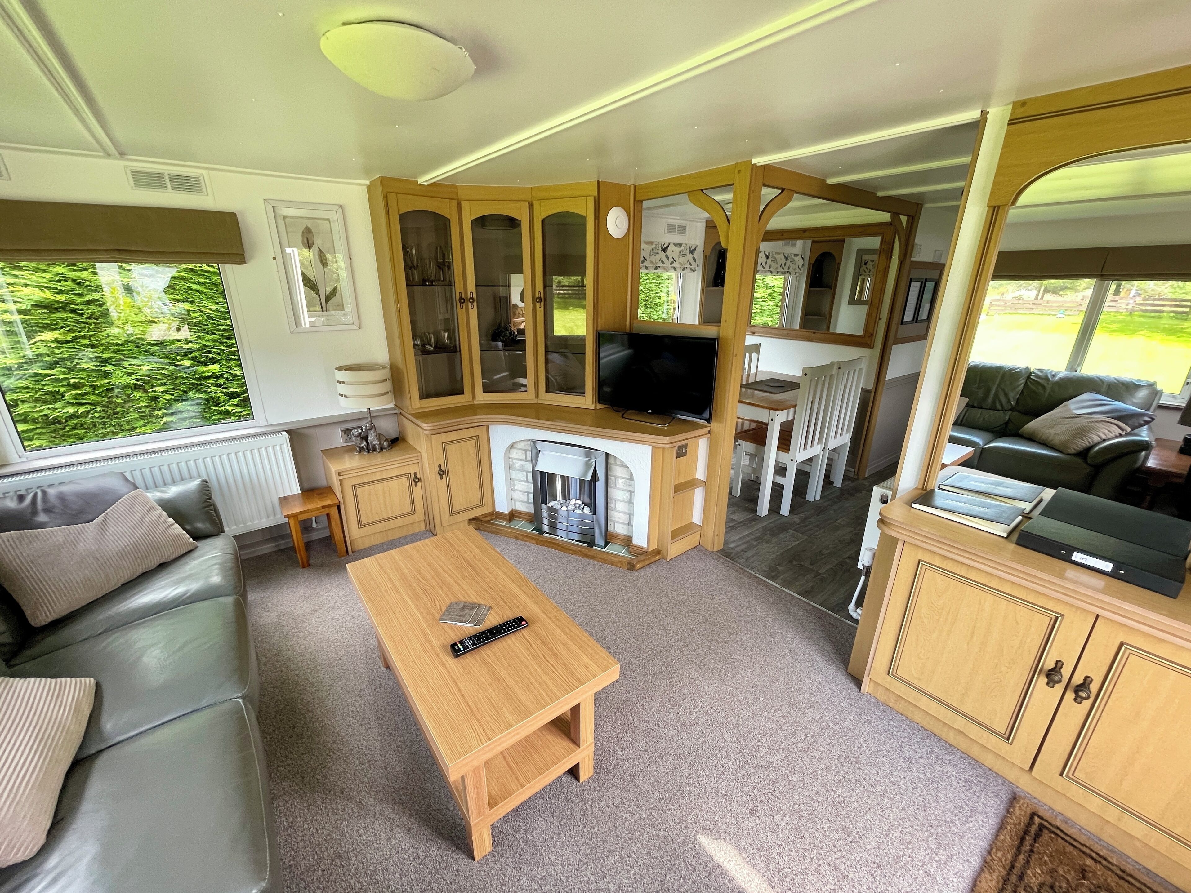 Standard House, 2 Bedrooms, Garden View | Living area | 32-inch flat-screen TV with digital channels, fireplace