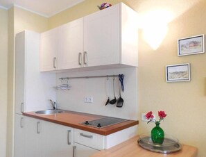 Fridge, stovetop, coffee/tea maker, toaster