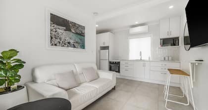 Relax and unwind in Beach Point 2, where modern comfort meets coastal charm.