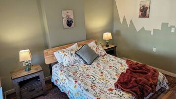 1 bedroom, desk, iron/ironing board, travel crib