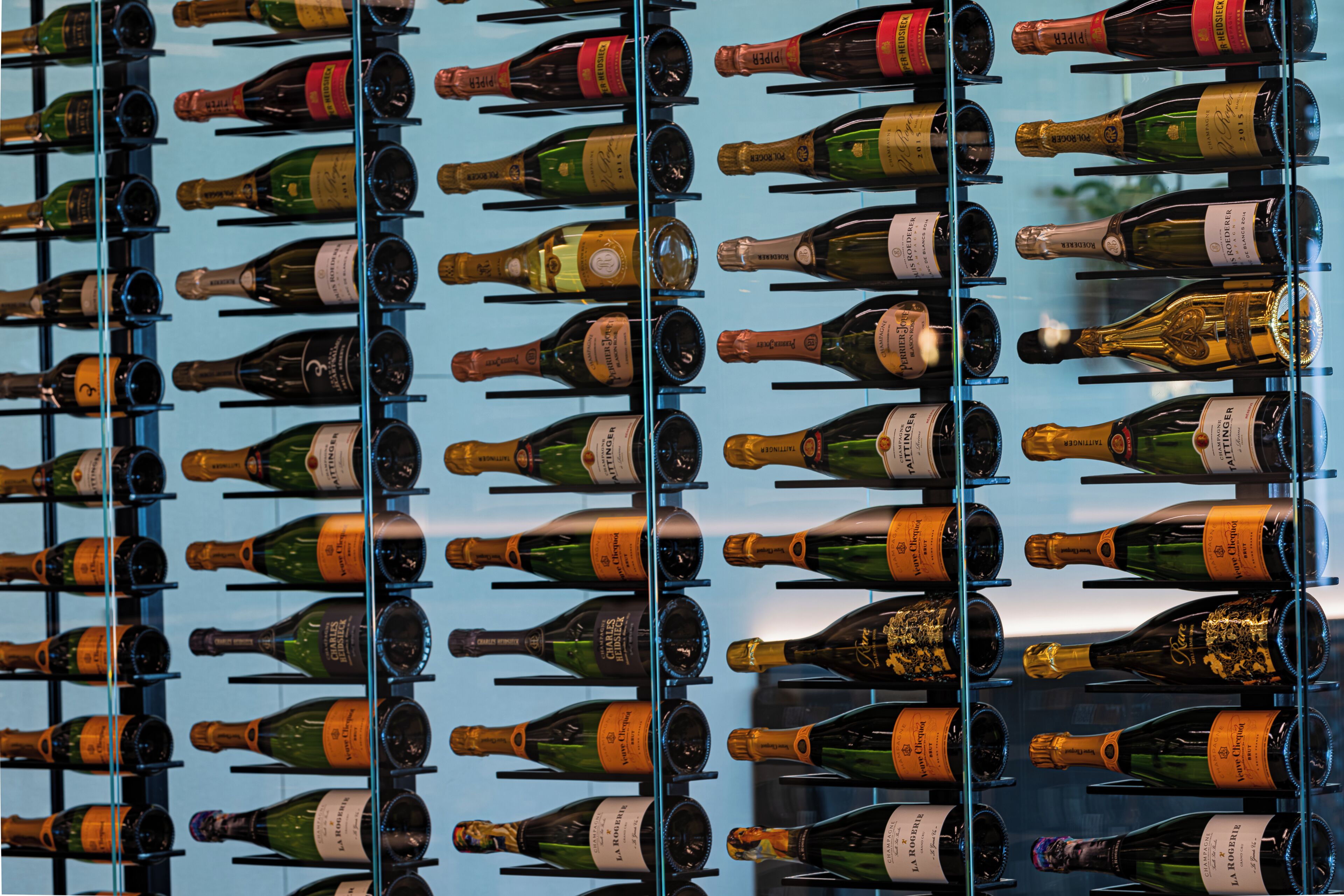 A wine rack with multiple bottles of wine.