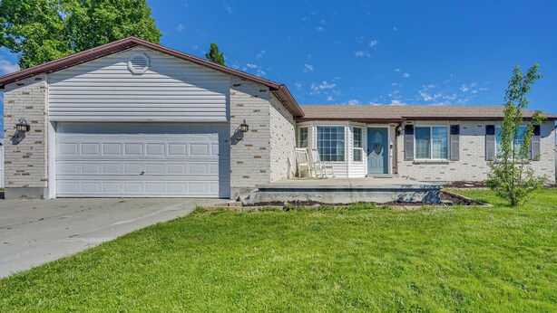 A two-story house with a garage, a front porch, and a small yard. - Lakefront Utah Home w/ Private Beach, Dock & Canoe (Tooele)