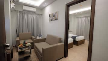 City Studio Suite, 1 Bedroom, Balcony | In-room safe, soundproofing, iron/ironing board, free WiFi