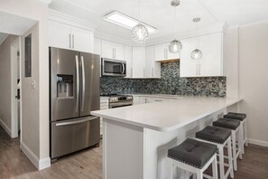 Fridge, microwave, oven, stovetop - Nicely Renovated Three Bedroom Oceanfront Condo (Ocean City)