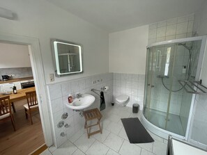 Shower, hair dryer, towels, soap