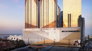 A modern hotel with multiple high-rise buildings, featuring prominent signage and a distinctive architectural design. - Shangri-La Phnom Penh (Phnom Penh)