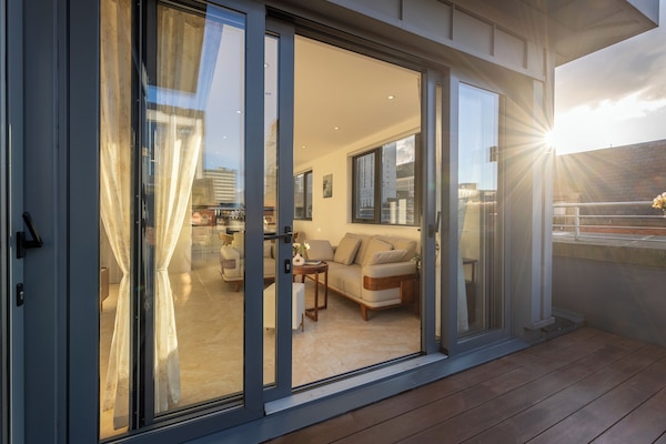 Deluxe Triple Room, 3 Bedrooms, City View | Living area | Heated floors