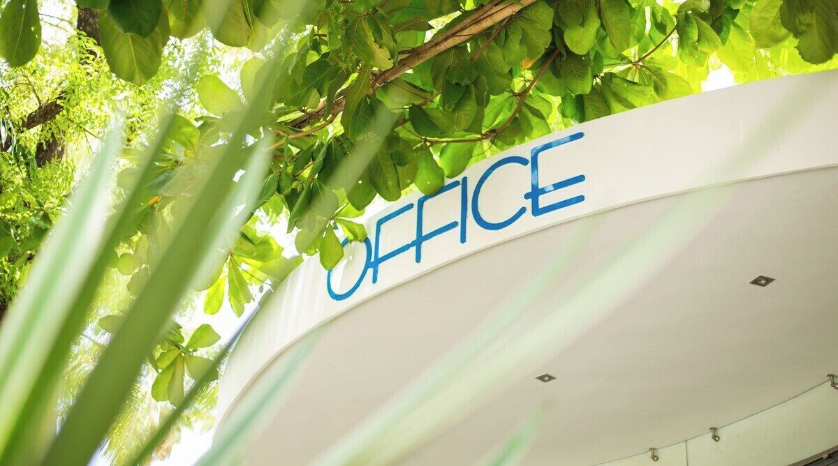 A sign with the word "OFFICE" on a building.